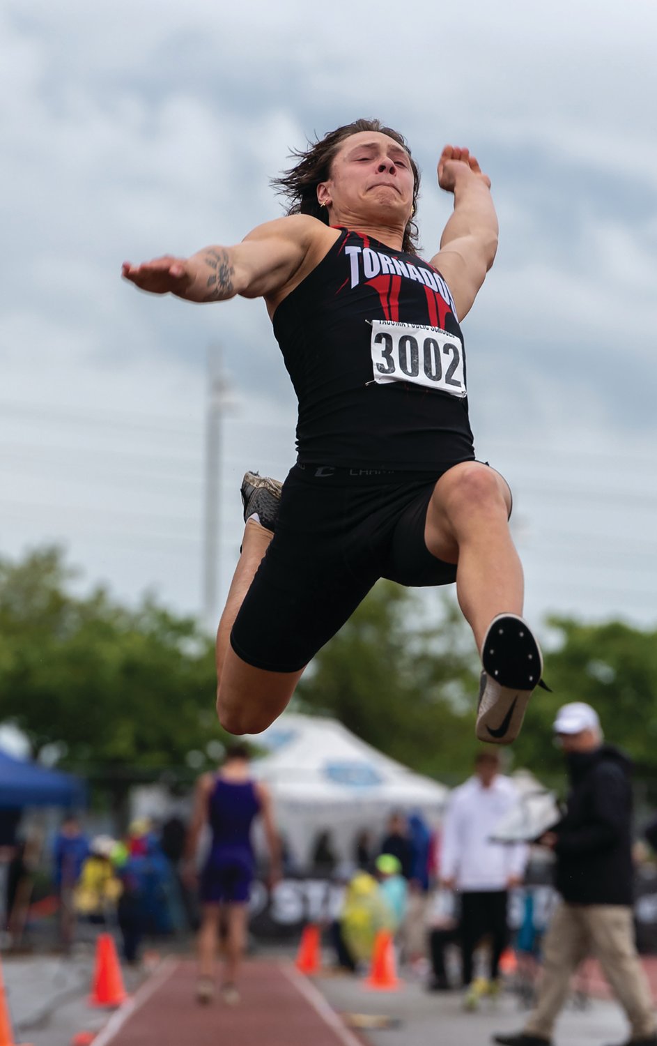Yelm's Kyler Ronquillo long jumps at the 2A/3A/4A State Track and Field Championships on Thursday, May 26, 2022, at Mount Tahoma High School in Tacoma. (Joshua Hart/For XXXX)